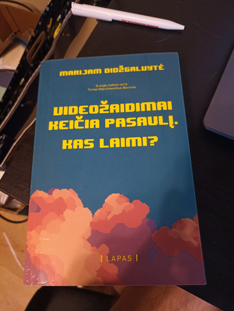 Knygos „Videožaidimai keičia pasaulį. Kas laimi?“ viršelio nuotrauka